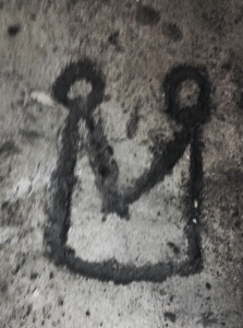 Mast Brothers logo,  carved into the cement of their building